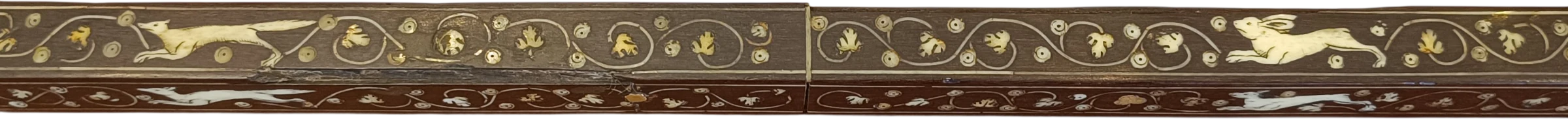 Face 4, two large engraved decorative fields: a fox-like animal on the left and a hare-like animal on the right, both facing left; scrolling foliage surrounds the animals.
